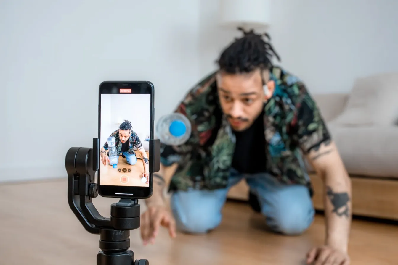 A young creator filming a video on a phone